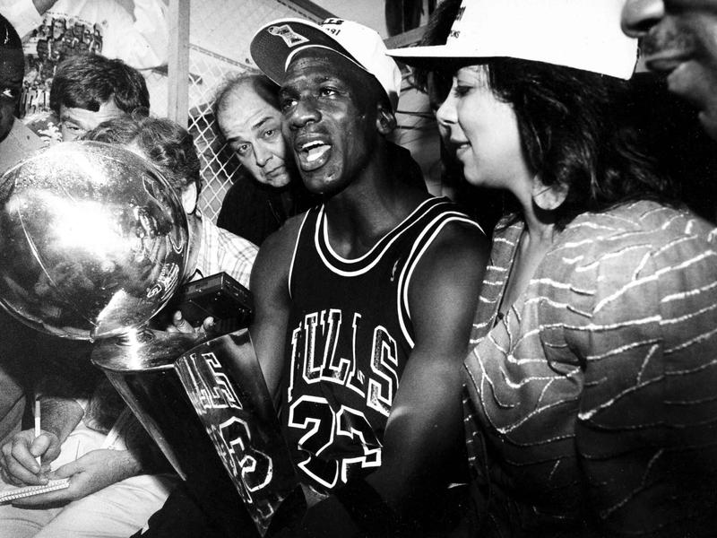 ChicagoBulls' Michael Jordan and Juanita Vanoy with the NBA championship trophy after the Bulls' win over the Los Angeles Lakers in 1991.