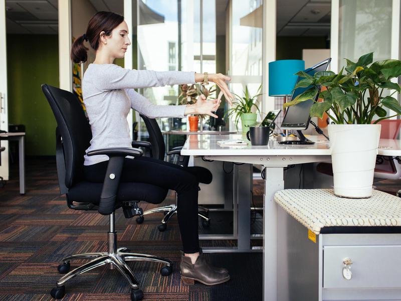 4 Yoga Poses You Can Do At Your Desk | The Centre